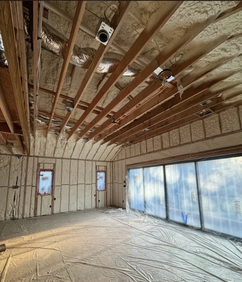 Interior walls and ceiling insulated with spray foam during new construction in Herrin